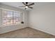 Cozy bedroom with tile floors and bright window letting in plenty of natural light at 19443 N 36Th St, Phoenix, AZ 85050