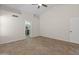 Large bedroom featuring an ensuite bathroom and ceiling fan at 19443 N 36Th St, Phoenix, AZ 85050