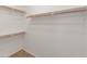 Walk-in closet featuring a custom shelving system to maximize organization and storage at 19443 N 36Th St, Phoenix, AZ 85050