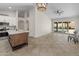 Open concept featuring the kitchen island, living room, and backyard pool view at 19443 N 36Th St, Phoenix, AZ 85050
