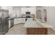 Beautiful kitchen with custom cabinets, stainless appliances, and a spacious central island at 19443 N 36Th St, Phoenix, AZ 85050