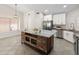 Lovely kitchen featuring a stone island, stainless appliances, and ample natural light at 19443 N 36Th St, Phoenix, AZ 85050