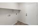 Functional laundry room featuring utility connections and convenient access to the exterior at 19443 N 36Th St, Phoenix, AZ 85050