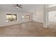 Open-concept living room with tile flooring and backyard pool views at 19443 N 36Th St, Phoenix, AZ 85050