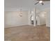 Large living room featuring arched doorways and tile flooring at 19443 N 36Th St, Phoenix, AZ 85050