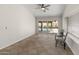 Living room with tile floors, neutral walls, and sliding doors overlooking the pool at 19443 N 36Th St, Phoenix, AZ 85050