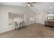 Spacious living room with modern lighting and a view of the kitchen at 19443 N 36Th St, Phoenix, AZ 85050