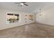 Bright living area with large windows offering views of the pool at 19443 N 36Th St, Phoenix, AZ 85050