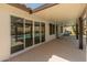 Covered patio with sliding doors offers a seamless transition to the backyard pool for relaxation and entertainment at 19443 N 36Th St, Phoenix, AZ 85050