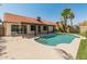 Inviting pool with steps, surrounded by a tile deck, lush landscaping and views of the home's architecture at 19443 N 36Th St, Phoenix, AZ 85050