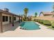 Serene pool area featuring a sparkling pool, mature trees, and a covered patio for outdoor enjoyment at 19443 N 36Th St, Phoenix, AZ 85050