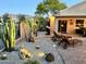Serene backyard patio featuring lounge chairs, desert landscaping, and a peaceful atmosphere at 2 W Pasture Canyon Dr, San Tan Valley, AZ 85143