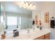 Bright bathroom boasts a double sink vanity, soaking tub with a shower, and tiled floors at 2 W Pasture Canyon Dr, San Tan Valley, AZ 85143