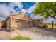 Home with a two-car garage, desert landscaping, and a neutral-colored exterior at 2 W Pasture Canyon Dr, San Tan Valley, AZ 85143