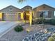 Charming home with a desert landscaped front yard featuring rocks and native plants at 2 W Pasture Canyon Dr, San Tan Valley, AZ 85143