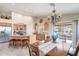 Open kitchen and dining area features stainless appliances, granite counters, and backyard access at 2 W Pasture Canyon Dr, San Tan Valley, AZ 85143