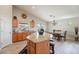 Open kitchen and dining area features stainless appliances, granite counters, and natural lighting at 2 W Pasture Canyon Dr, San Tan Valley, AZ 85143