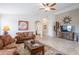 Open concept living room with tile floors, ceiling fan, and desert decor at 2 W Pasture Canyon Dr, San Tan Valley, AZ 85143