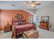 Warm main bedroom features vaulted ceilings, ceiling fan, rustic decor and furniture, and spacious layout at 2 W Pasture Canyon Dr, San Tan Valley, AZ 85143