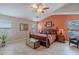 Warm main bedroom features a ceiling fan, rustic decor, and spacious layout with a cozy feel at 2 W Pasture Canyon Dr, San Tan Valley, AZ 85143