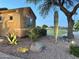 Landscaped side yard with a cactus, rocks, and desert foliage at 2 W Pasture Canyon Dr, San Tan Valley, AZ 85143