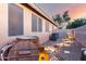 Backyard with an outdoor hot tub and decorative rock landscaping, as well as a privacy fence and patio at 2024 E Cherry Hills Pl, Chandler, AZ 85249