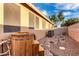 Private backyard with a wooden hot tub, serene landscaping, and unique stone accents at 2024 E Cherry Hills Pl, Chandler, AZ 85249