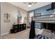 Bedroom featuring bunk beds, a ceiling fan, a blue accent wall, and carpet flooring at 2024 E Cherry Hills Pl, Chandler, AZ 85249