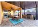 Spacious covered patio with outdoor kitchen and dining area, seamlessly blending indoor and outdoor living at 2024 E Cherry Hills Pl, Chandler, AZ 85249