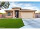 Inviting single-story home with a well-kept lawn, stone details, and a convenient two-car garage at 2024 E Cherry Hills Pl, Chandler, AZ 85249