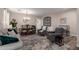 Comfortable living space features a cozy sitting area and a view of the dining area at 2024 E Cherry Hills Pl, Chandler, AZ 85249