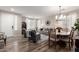 Spacious living area with wood-look floors, plush seating, and modern decor elements at 2024 E Cherry Hills Pl, Chandler, AZ 85249