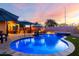 Captivating pool area featuring a spa, patio and outdoor kitchen; perfect for entertaining at 2024 E Cherry Hills Pl, Chandler, AZ 85249