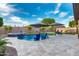 Beautiful backyard pool with lounge chairs and umbrellas on a travertine deck with a spa at 2024 E Cherry Hills Pl, Chandler, AZ 85249