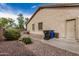 Low-maintenance backyard with desert landscaping, showing the exterior of the home, and garbage bins at 2112 E Yellowstone Pl Pl, Chandler, AZ 85249