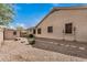 Low-maintenance backyard featuring desert landscaping, a shed, and a well-kept exterior of the home at 2112 E Yellowstone Pl Pl, Chandler, AZ 85249