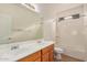 Bright bathroom features dual sinks, large mirror, and a combined shower and bathtub at 2112 E Yellowstone Pl Pl, Chandler, AZ 85249