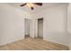 Light-filled bedroom with wood floors, neutral walls, and a closet with sliding doors at 2112 E Yellowstone Pl Pl, Chandler, AZ 85249