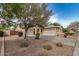 Charming single-story home with a well-maintained front yard, desert landscaping, and a three-car garage at 2112 E Yellowstone Pl Pl, Chandler, AZ 85249