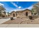 Charming single-story home with desert landscaping, an arched entryway, and a spacious driveway at 2112 E Yellowstone Pl Pl, Chandler, AZ 85249