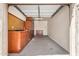 Spacious garage with storage cabinets, a workbench, and ample room for vehicles and projects at 2112 E Yellowstone Pl Pl, Chandler, AZ 85249