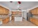 Open kitchen featuring wood cabinets, stainless steel appliances, and a kitchen island at 2112 E Yellowstone Pl Pl, Chandler, AZ 85249