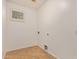 Simple laundry room with a small window, neutral walls, tile floors, and essential hookups at 2112 E Yellowstone Pl Pl, Chandler, AZ 85249