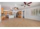 Spacious room with tile floors, ceiling fans, open to the kitchen at 2112 E Yellowstone Pl Pl, Chandler, AZ 85249