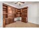 Office with custom cabinetry and storage, featuring tile flooring and neutral wall colors at 2112 E Yellowstone Pl Pl, Chandler, AZ 85249