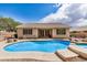 Gorgeous pool with steps, desert landscaping, and backyard views of the home's exterior at 2112 E Yellowstone Pl Pl, Chandler, AZ 85249