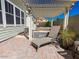 Relaxing backyard with covered patio, chaise lounge and desert landscaping at 21134 W Green St, Buckeye, AZ 85396