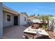 Backyard patio with bar seating, fire pit, and palm trees at 21134 W Green St, Buckeye, AZ 85396