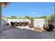 Backyard patio with bar seating and fire pit with lounge chairs at 21134 W Green St, Buckeye, AZ 85396