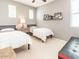 Comfortable bedroom with two beds and ample natural light at 21134 W Green St, Buckeye, AZ 85396
